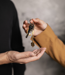 afford a new home, Getting Finances in Order to Buy a House (Part 1: Is This the Right Time for You to Buy?), image of keys being handed to a person buying a house