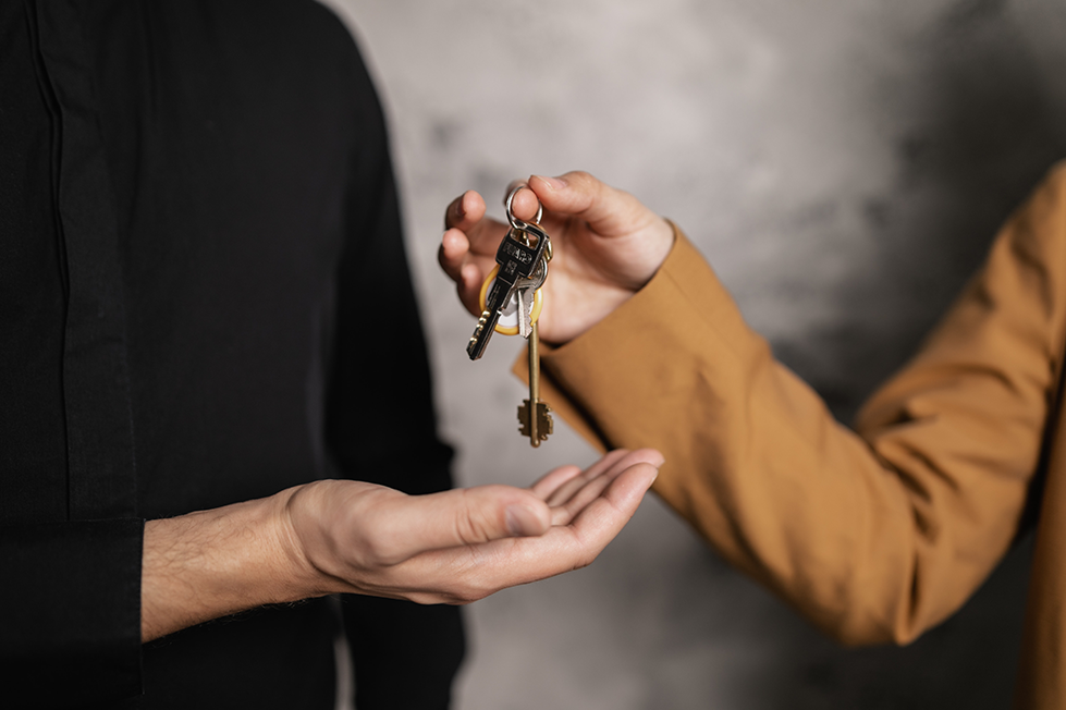 afford a new home, Getting Finances in Order to Buy a House (Part 1: Is This the Right Time for You to Buy?), image of keys being handed to a person buying a house